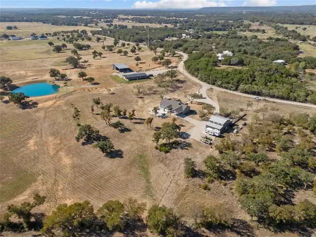 an aerial view of residential houses with outdoor space