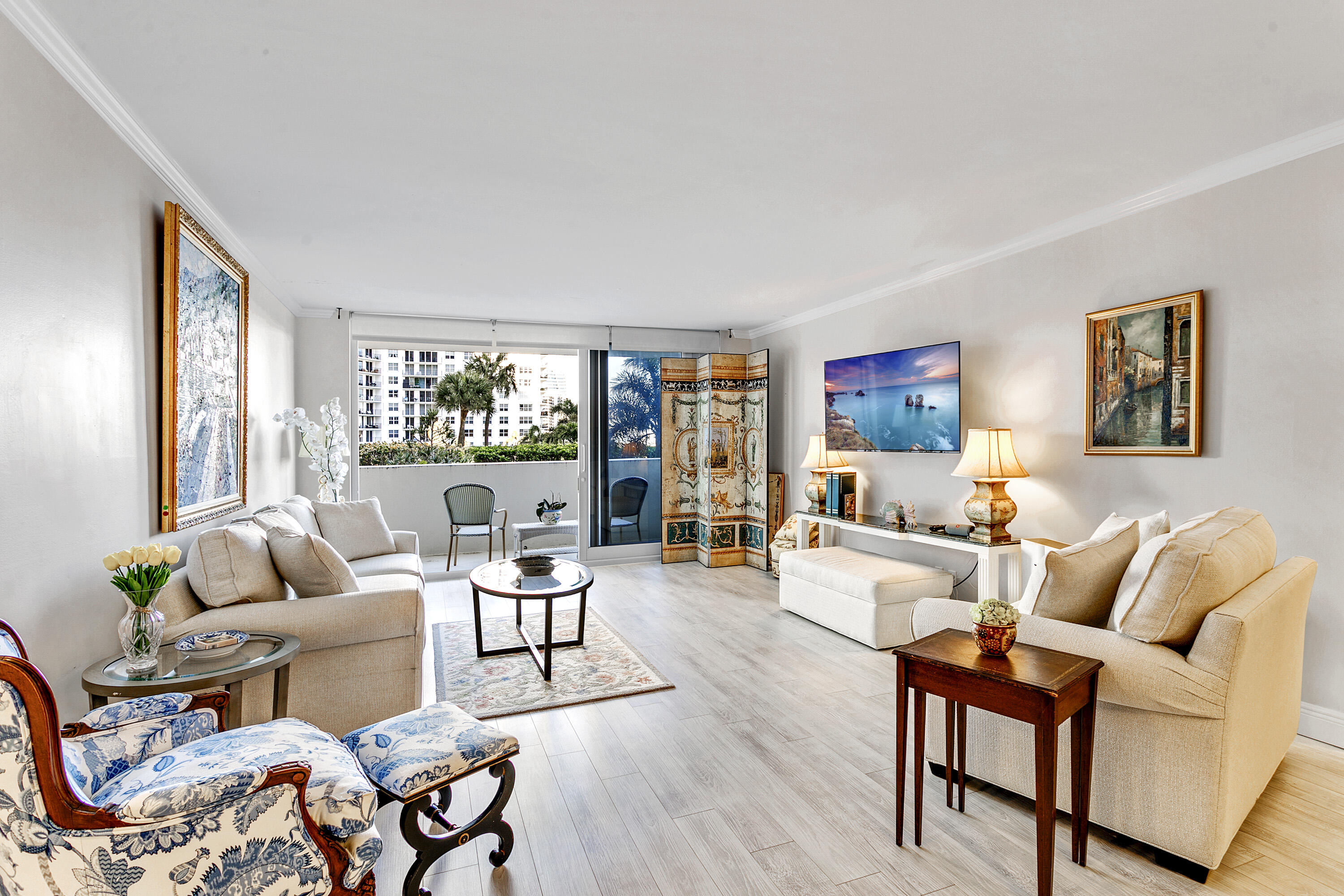 a living room with furniture and a large window