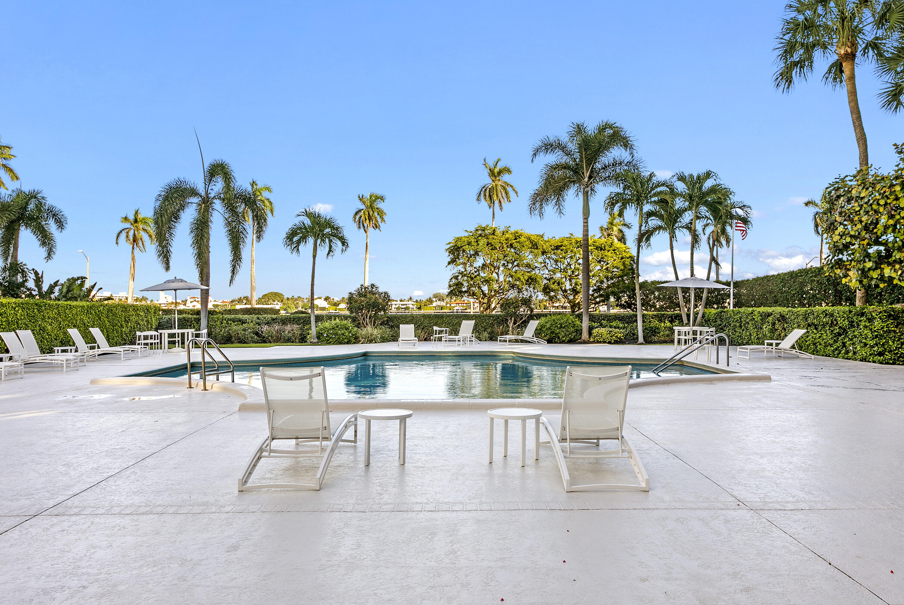 1801 South Flagler Drive, Unit 205 West Palm Beach, FL 33401 - Photo 14 of 16 a view of a swimming pool with a table and chairs