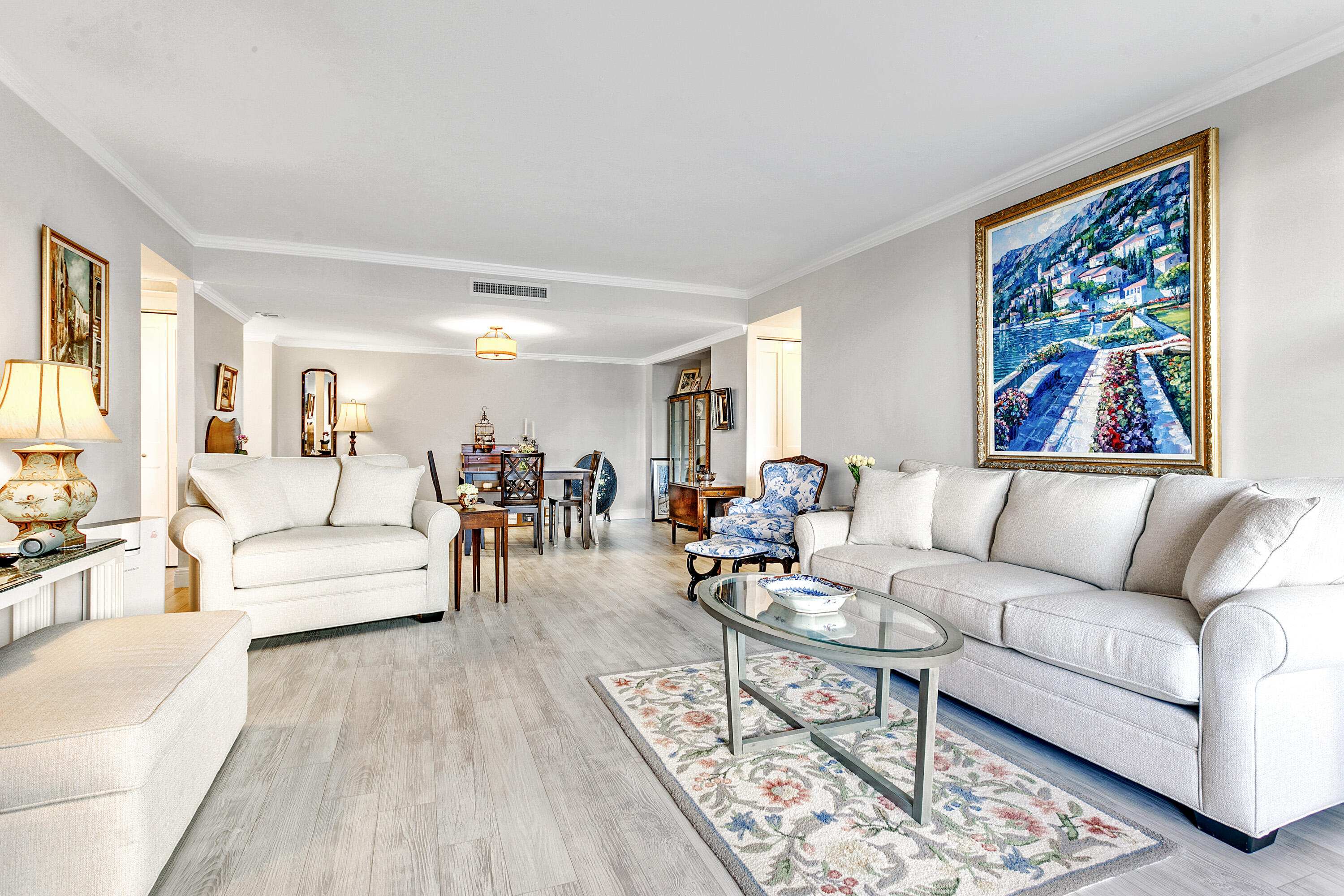1801 South Flagler Drive, Unit 205 West Palm Beach, FL 33401 - Photo 3 of 16 a living room with furniture and painting on the wall