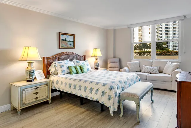 a bedroom with a bed and a couch