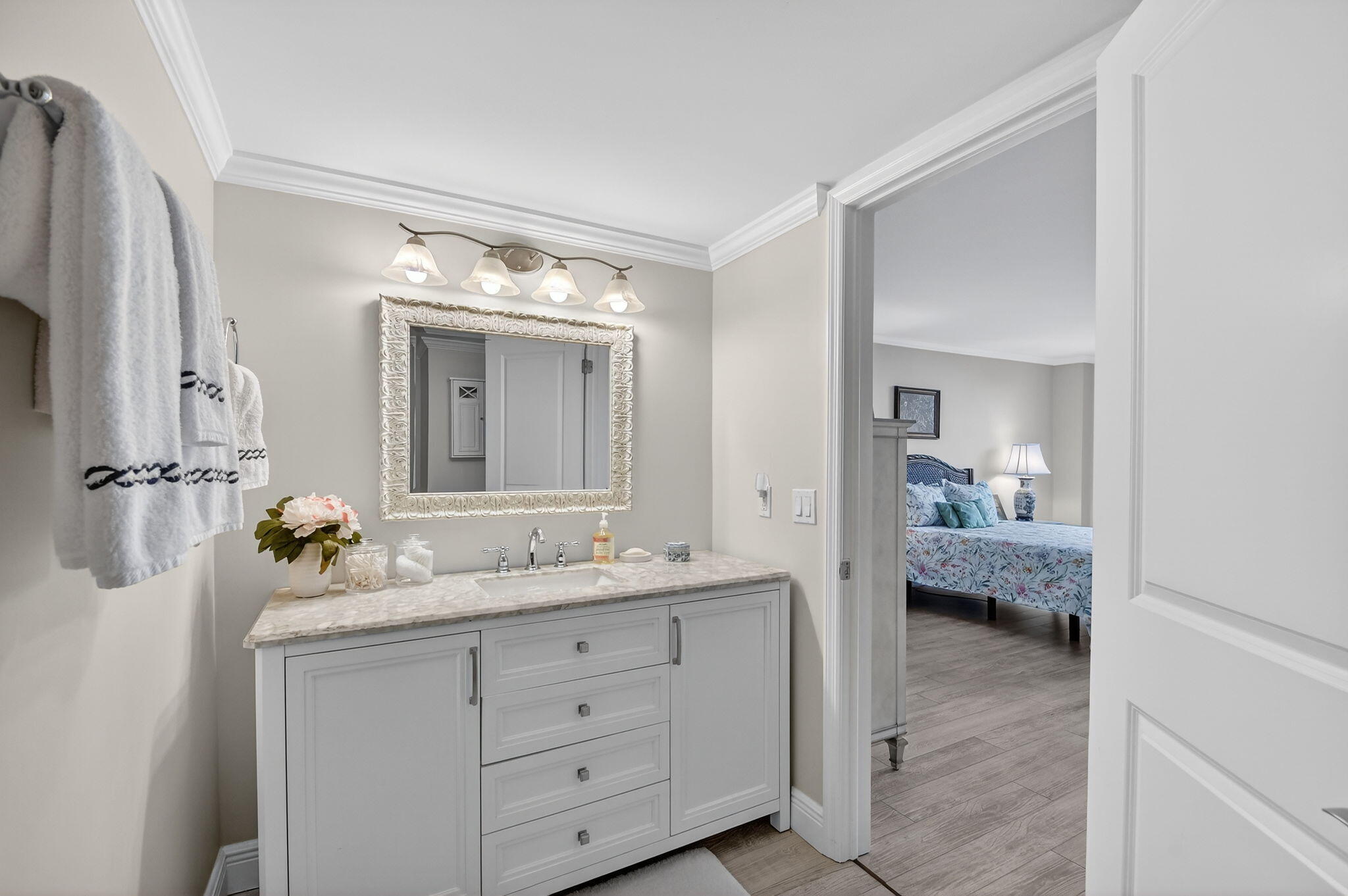 1801 South Flagler Drive, Unit 205 West Palm Beach, FL 33401 - Photo 6 of 16 a en suite bathroom with a double sink and mirror