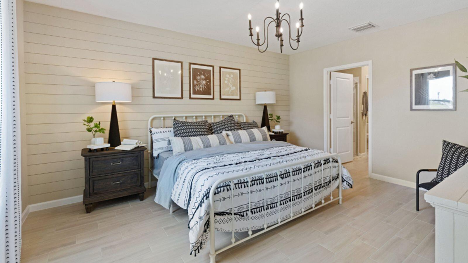 2211 Marigold Trail Palm Bay, FL 32907 - Photo 7 of 17 a bedroom with a bed and a chandelier