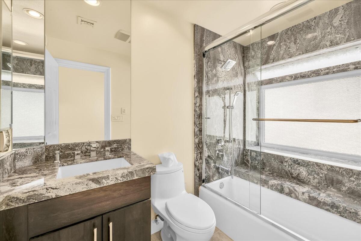 39 Santo Domingo Drive Rancho Mirage, CA 92270 - Photo 18 of 30 a bathroom with a granite countertop sink toilet and shower