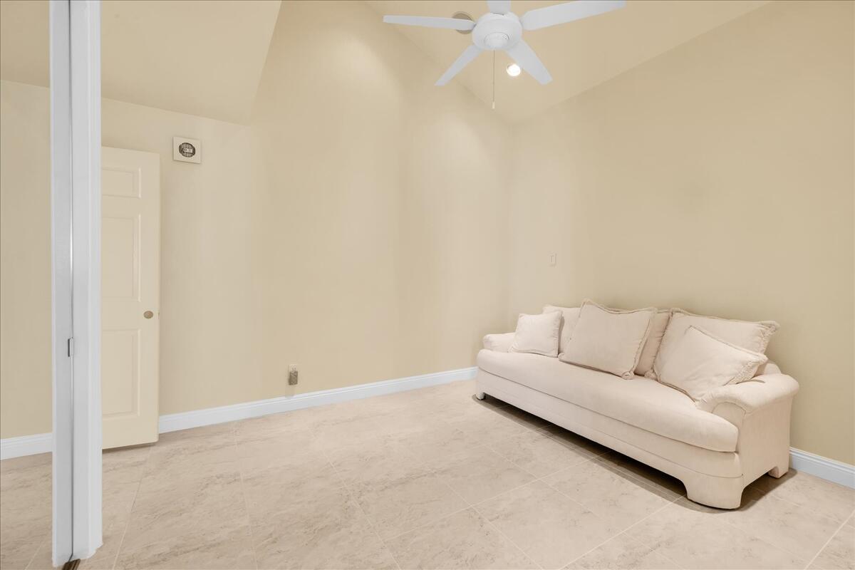 39 Santo Domingo Drive Rancho Mirage, CA 92270 - Photo 23 of 30 a living room with furniture and a white wall