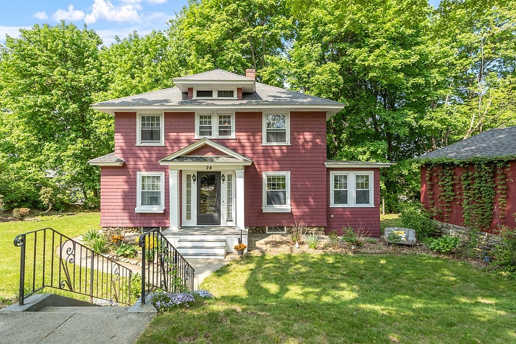 front view of a house with a yard