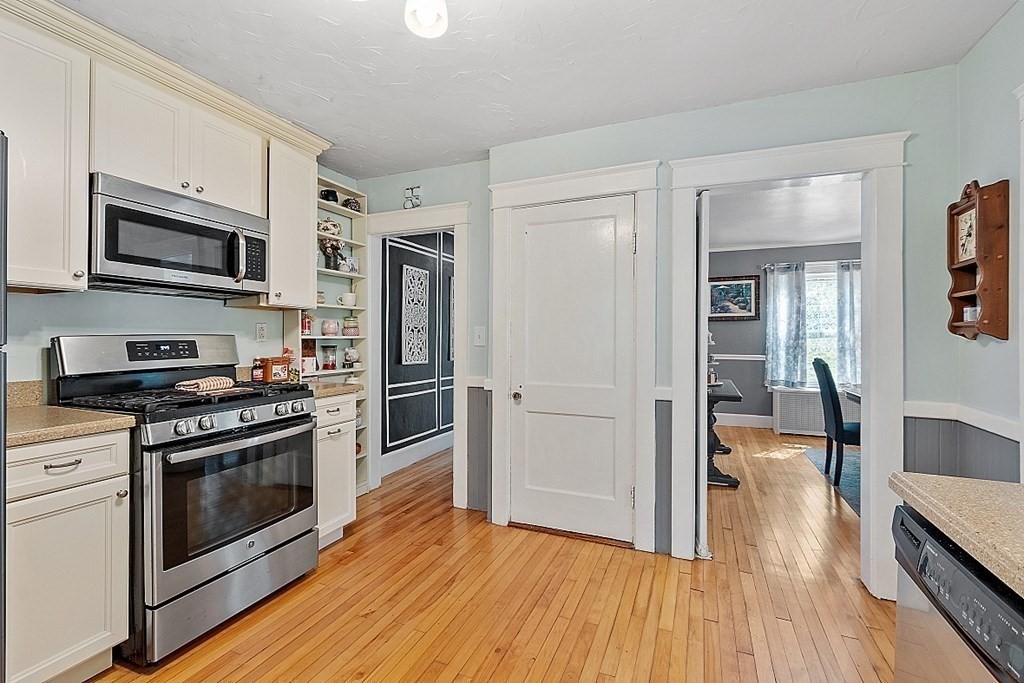 24 Maplewood Road Worcester, MA 01602 - Photo 14 of 42 a kitchen with stainless steel appliances a stove top oven and refrigerator