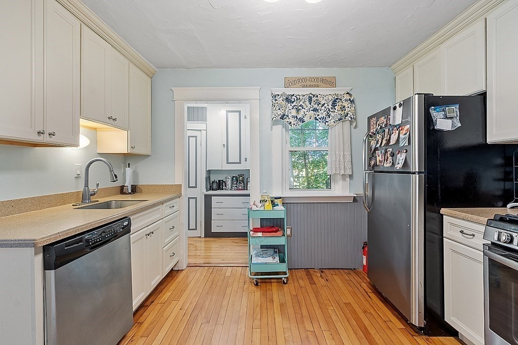24 Maplewood Road Worcester, MA 01602 - Photo 15 of 42 a kitchen with a refrigerator and a sink