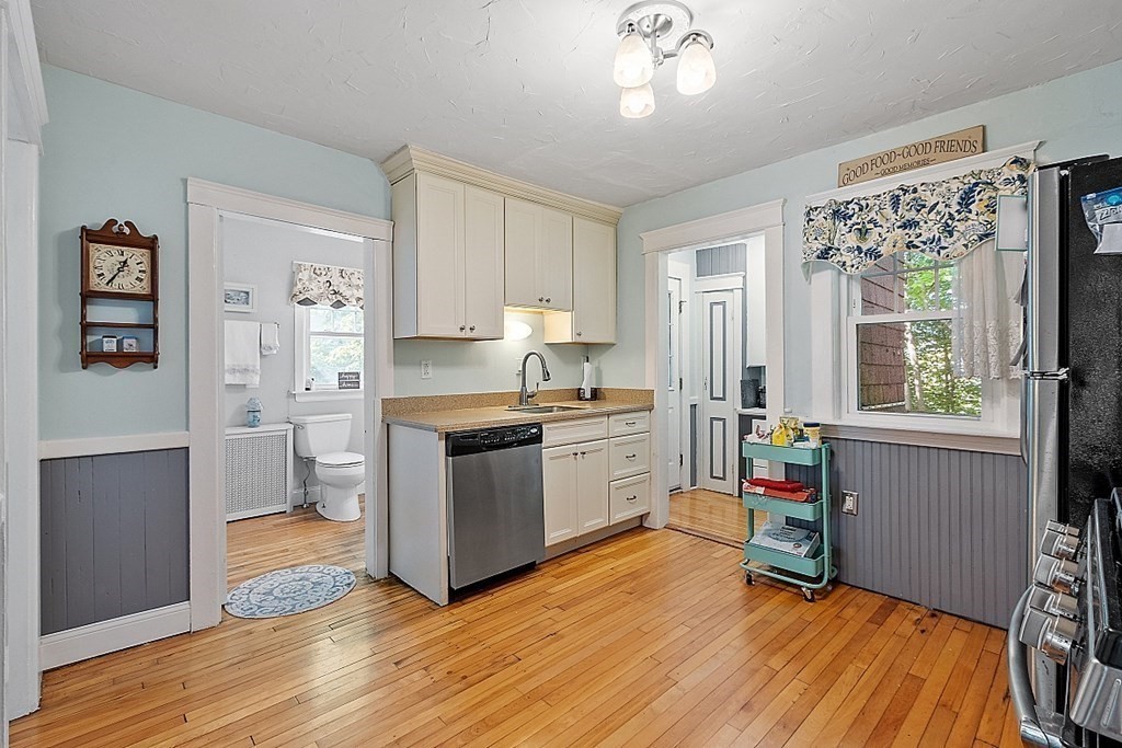24 Maplewood Road Worcester, MA 01602 - Photo 16 of 42 a kitchen with a refrigerator and a stove top oven