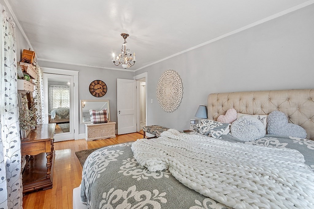 24 Maplewood Road Worcester, MA 01602 - Photo 23 of 42 a bed room with a bed mirror and a window