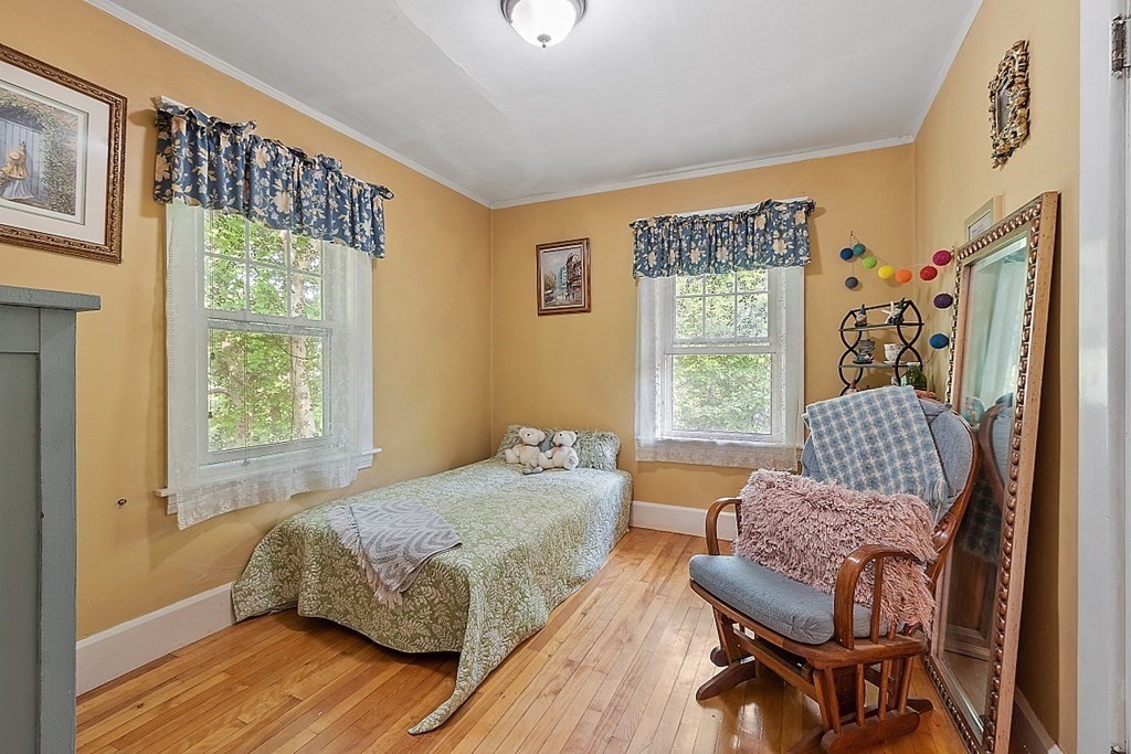 24 Maplewood Road Worcester, MA 01602 - Photo 24 of 42 a bedroom with a bed and wooden floor