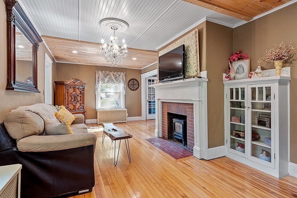 24 Maplewood Road Worcester, MA 01602 - Photo 7 of 42 a living room with furniture fireplace and flat screen tv