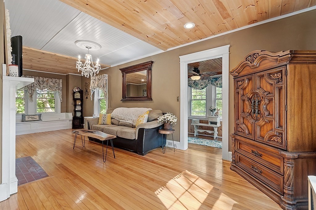24 Maplewood Road Worcester, MA 01602 - Photo 8 of 42 a living room with furniture and a chandelier