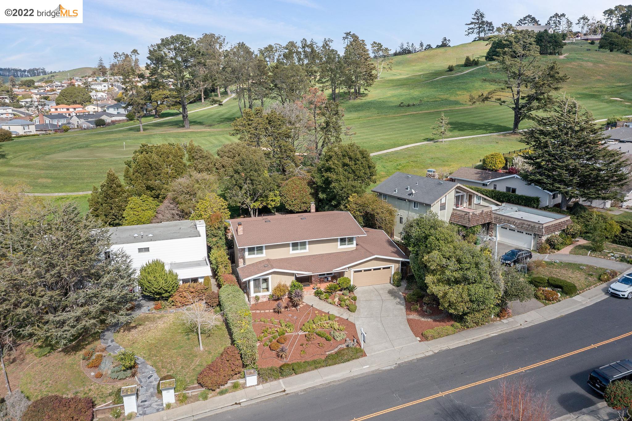 an aerial view of a house with outdoor space