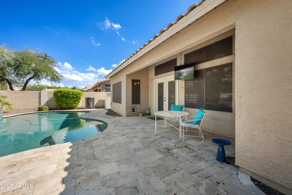 a view of a backyard with plants and lake view