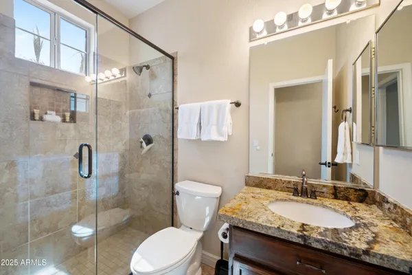 a bedroom with furniture and a window