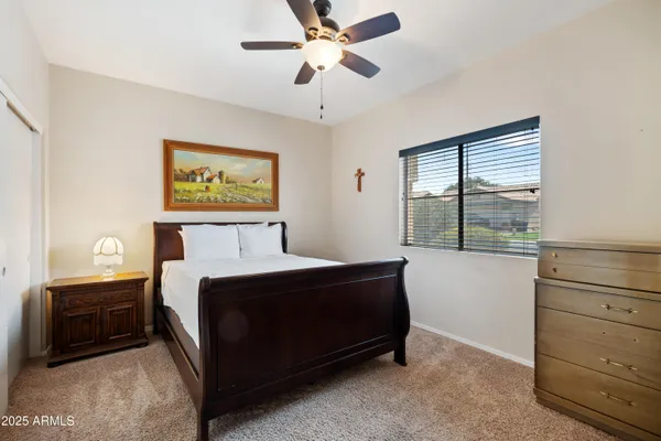 a bathroom with a granite countertop toilet sink and shower