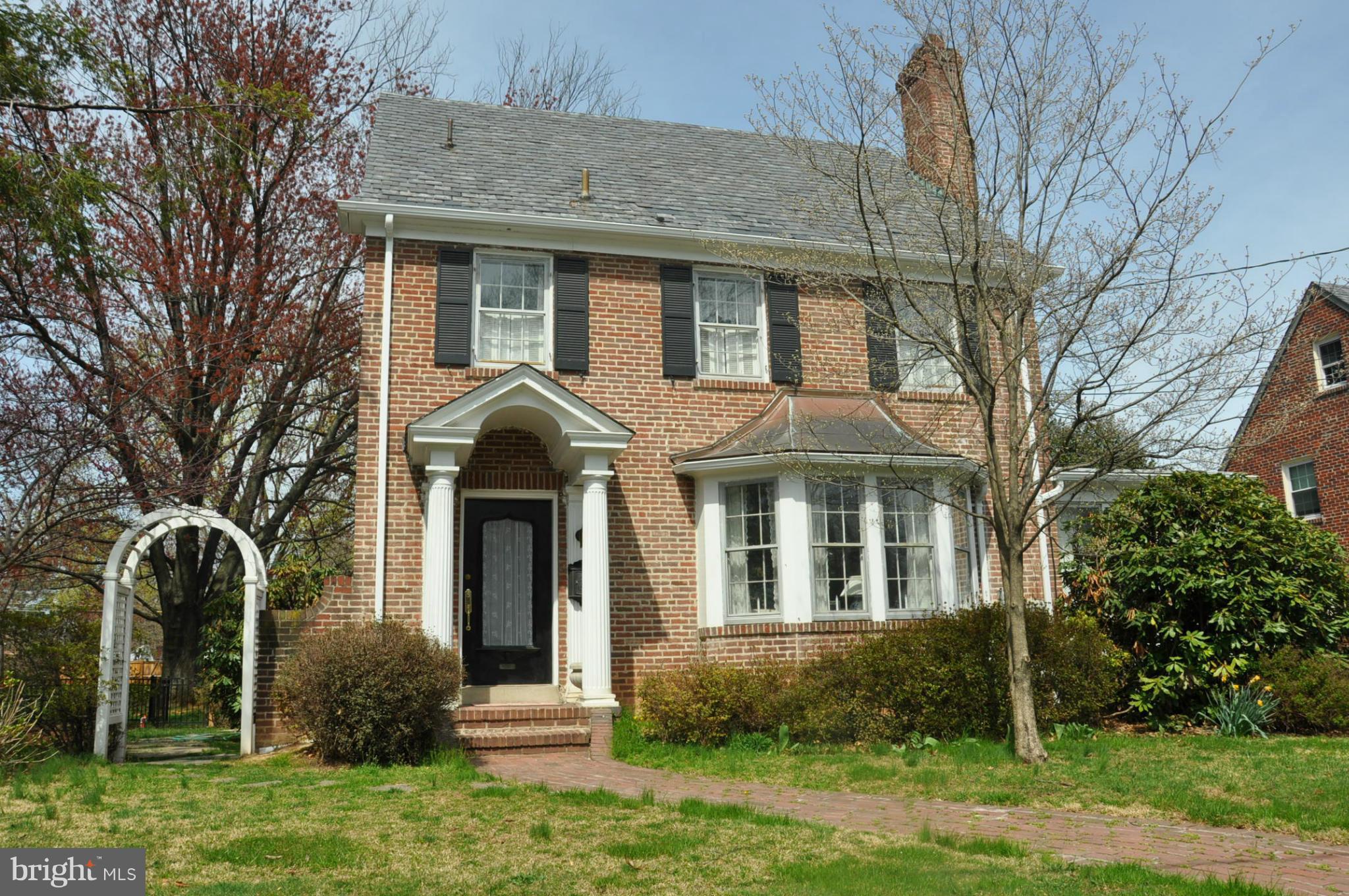 1953 Seminary Road Silver Spring, MD 20910 - Photo 1 of 23 a front view of a house with garden