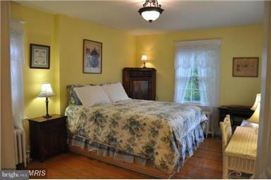1953 Seminary Road Silver Spring, MD 20910 - Photo 19 of 23 a bedroom with a bed and lamp