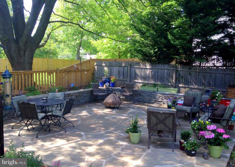 1953 Seminary Road Silver Spring, MD 20910 - Photo 6 of 23 a view of a chairs and table in backyard