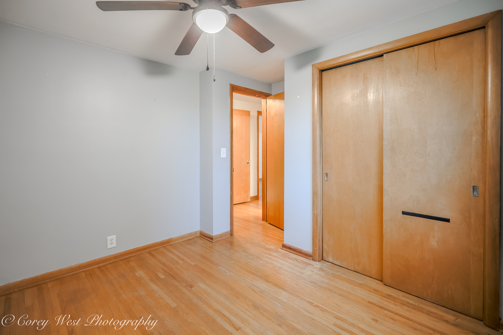 8994 Highway 64 Sycamore, IL 60178 - Photo 21 of 37 a view of an empty room with wooden floor and a window