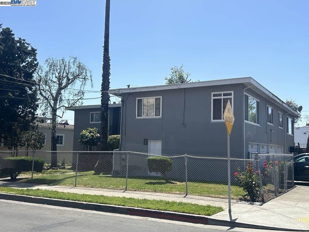 5775 Walnut Street Oakland, CA 94605 - Photo 3 of 3 a view of a house with backyard and plants