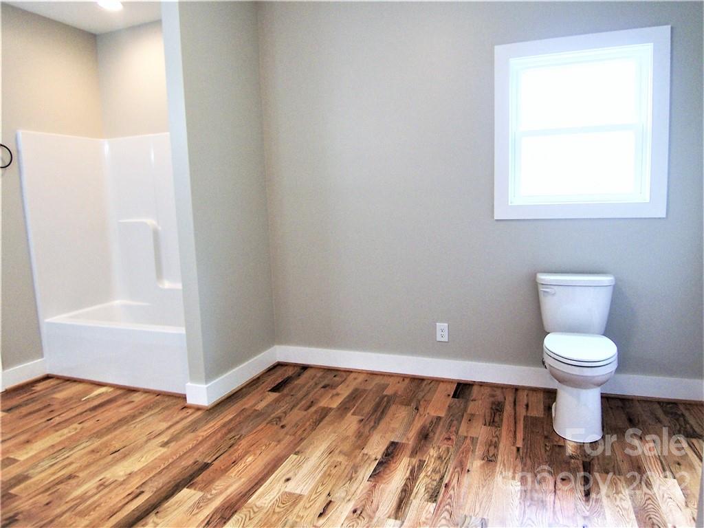 2933 Philadelphia Road Lawndale, NC 28090 - Photo 24 of 43 a bathroom with a sink and a toilet