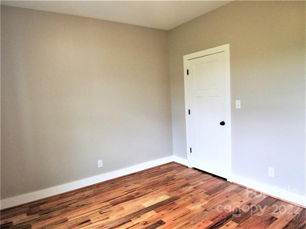 2933 Philadelphia Road Lawndale, NC 28090 - Photo 34 of 43 a view of empty room with wooden floor
