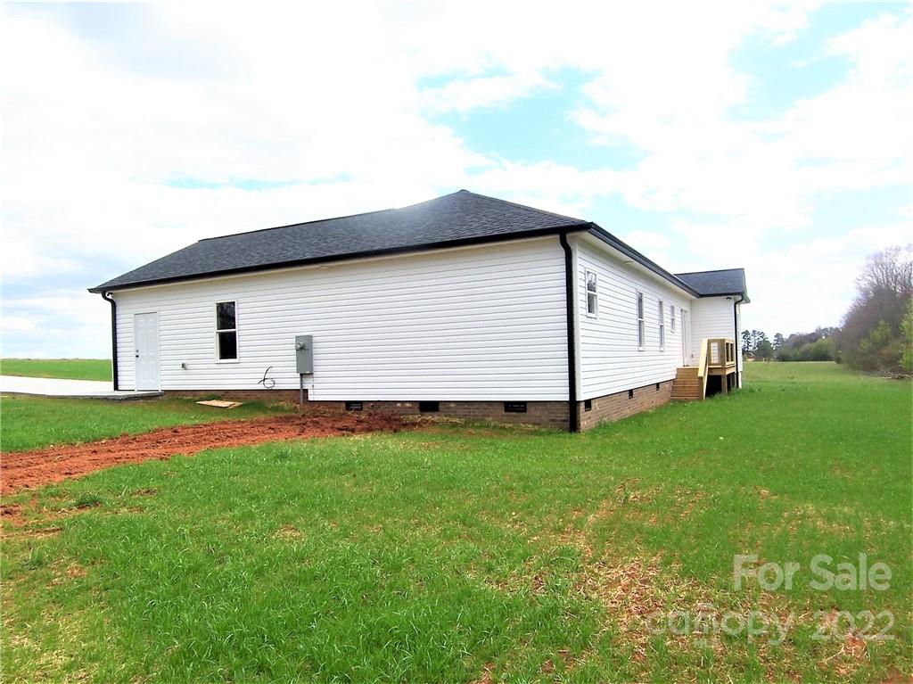 2933 Philadelphia Road Lawndale, NC 28090 - Photo 42 of 43 a view of a backyard with a garden