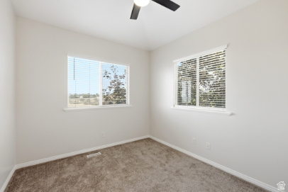 722 West Webb Circle, Unit 2 Draper, UT 84020 - Photo 13 of 39 Neutral wall tones with soft carpet flooring