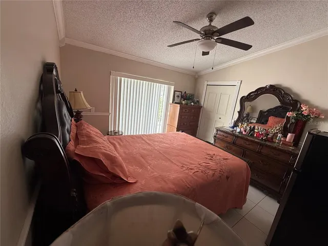 a bed sitting in a bedroom and bedroom