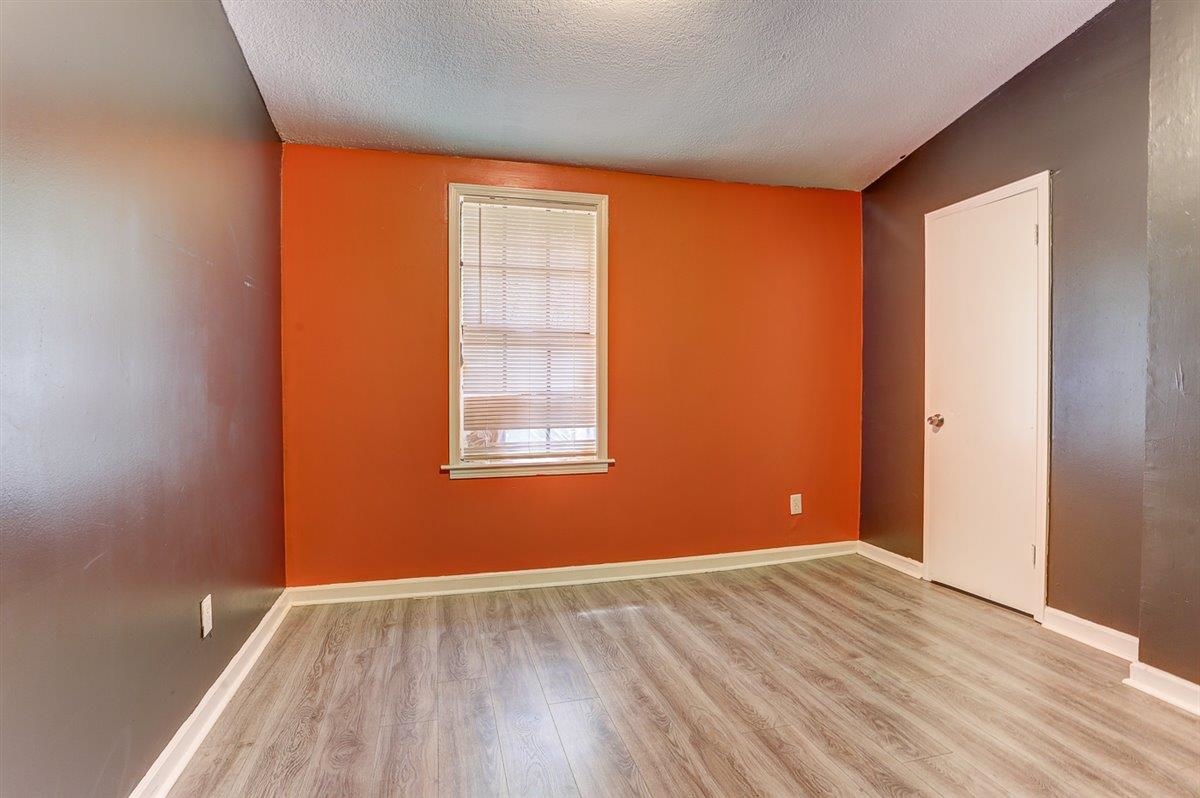 3700 Lakeview Road Memphis, TN 38116 - Photo 31 of 40 Unfurnished room with light wood-style floors and a textured ceiling