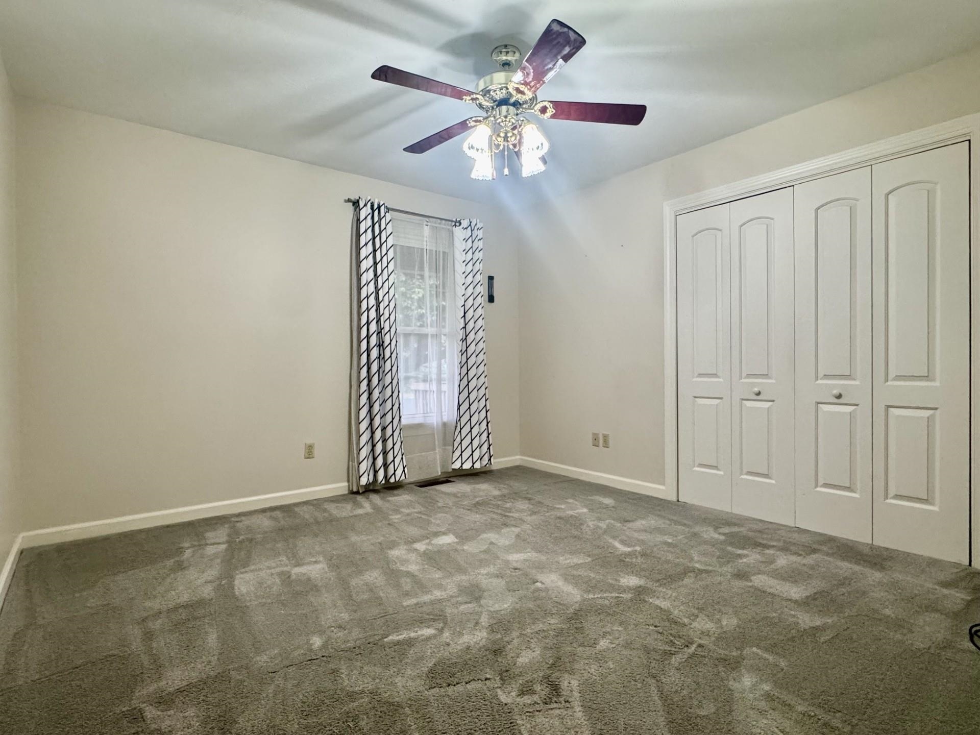 81 Middlebrook Street Harrisonburg, VA 22801 - Photo 7 of 22 an empty room with windows and fan