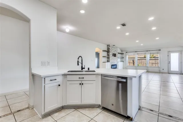 a kitchen with a sink and cabinets