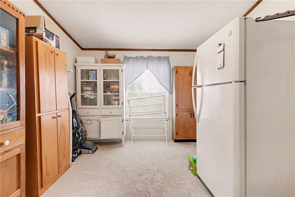 99 James Drive Hampton, GA 30228 - Photo 11 of 25 a view of a storage & utility room with closet