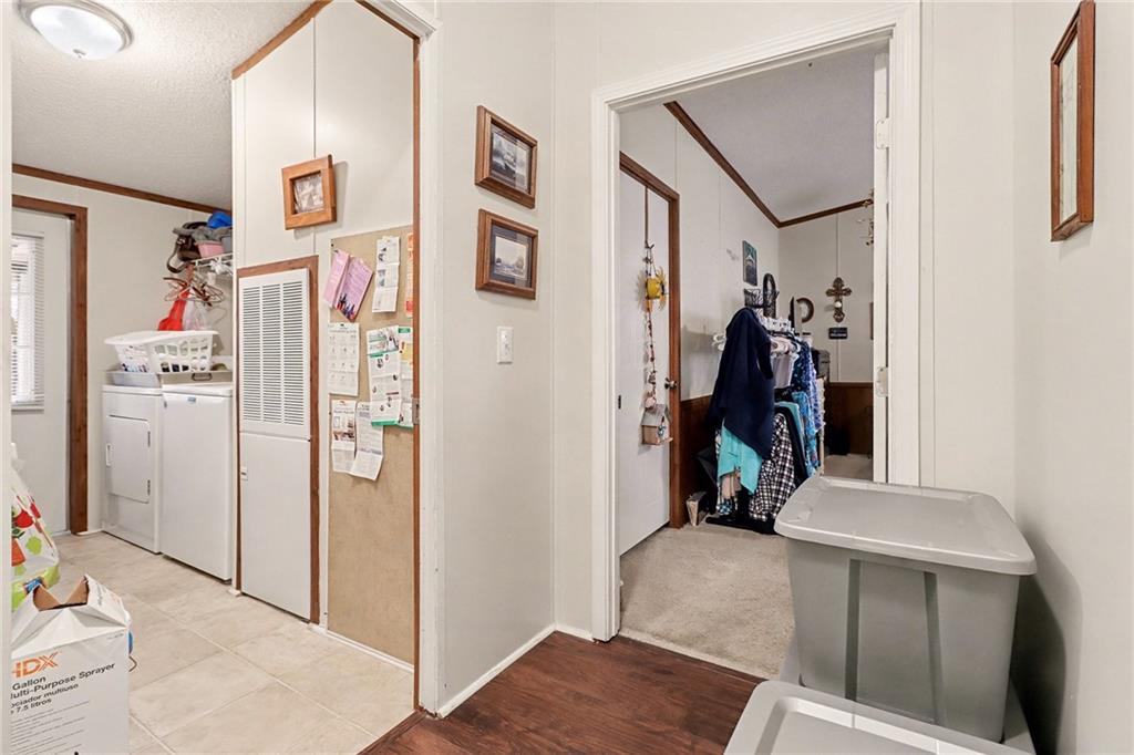 99 James Drive Hampton, GA 30228 - Photo 13 of 25 a view of walk in closet with clothes and shoes