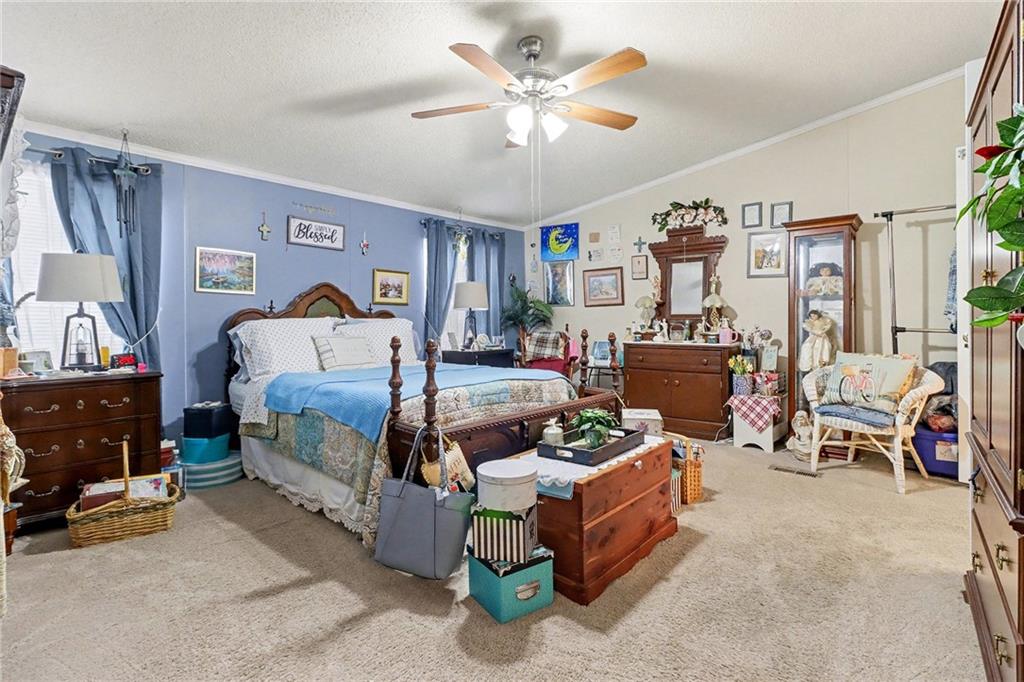 99 James Drive Hampton, GA 30228 - Photo 14 of 25 a living room with furniture and a window