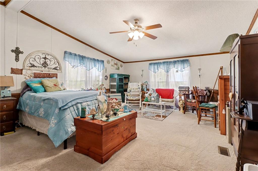99 James Drive Hampton, GA 30228 - Photo 19 of 25 a living room with furniture and kitchen view