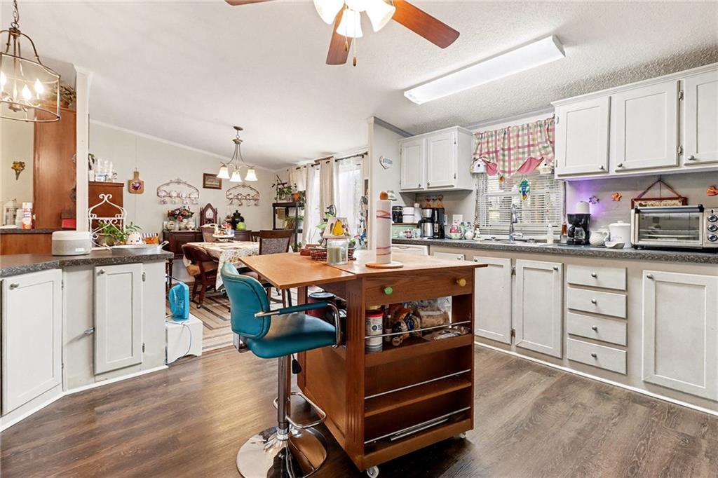 99 James Drive Hampton, GA 30228 - Photo 7 of 25 a kitchen with kitchen island granite countertop lots of counter top space