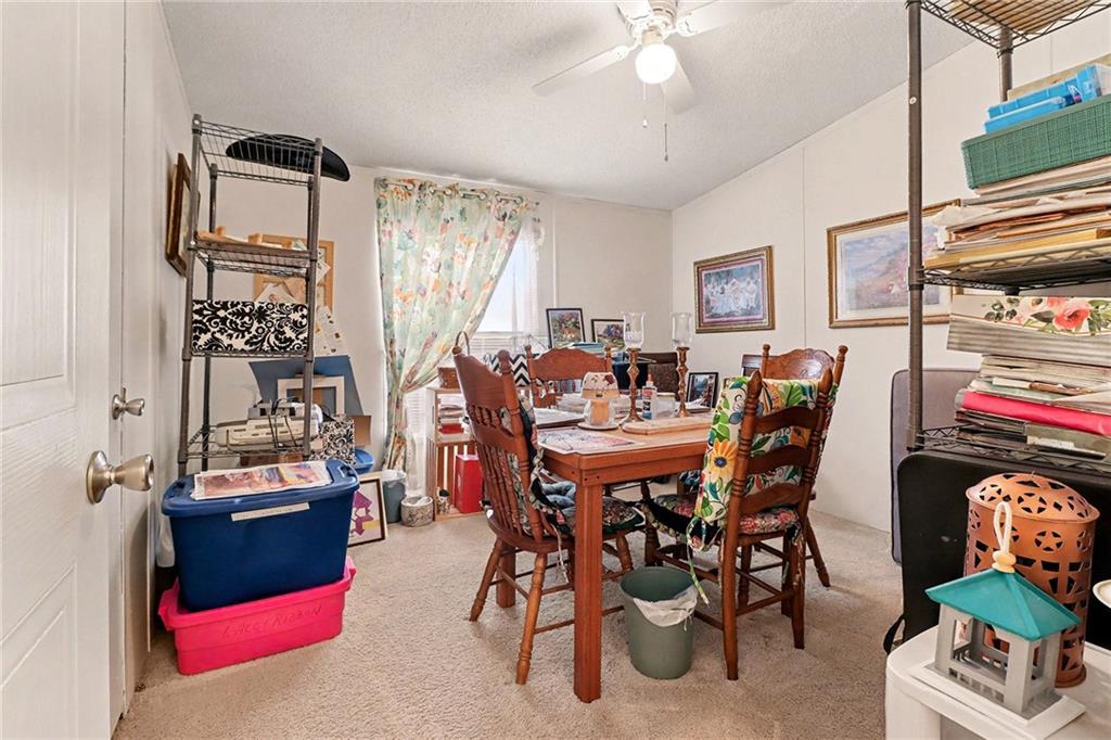 99 James Drive Hampton, GA 30228 - Photo 10 of 25 a view of a dining room with furniture and chandelier