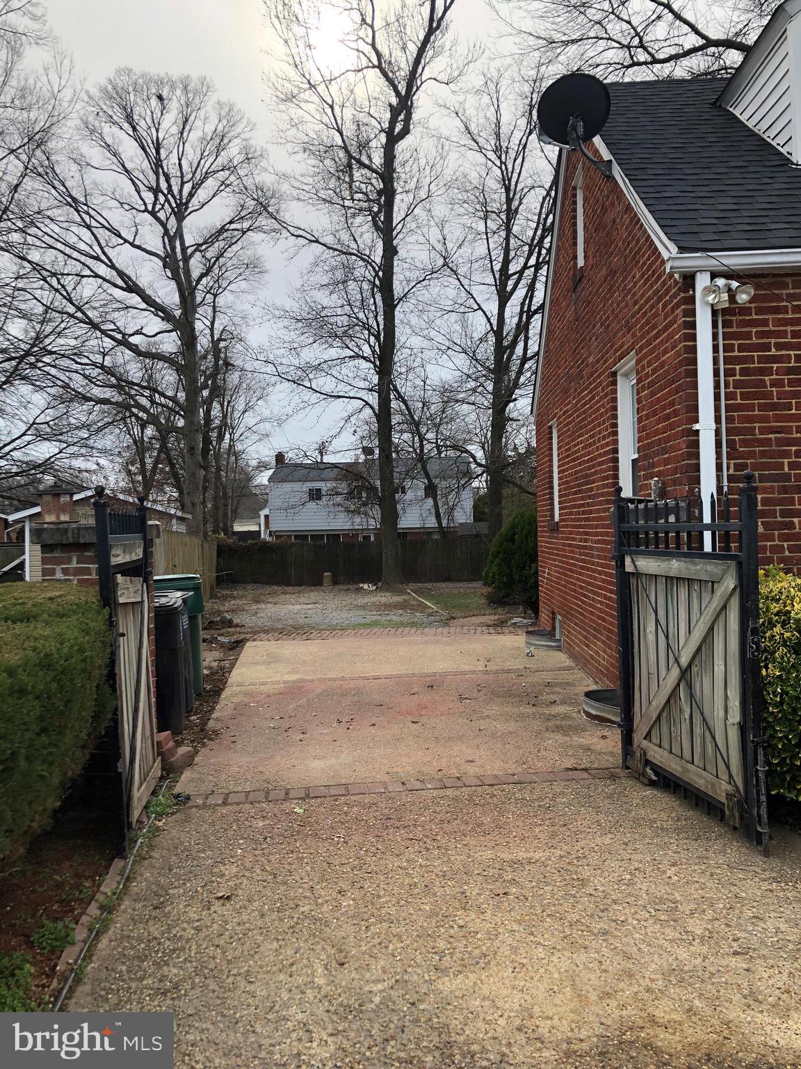 Gate opens up to additional parking.