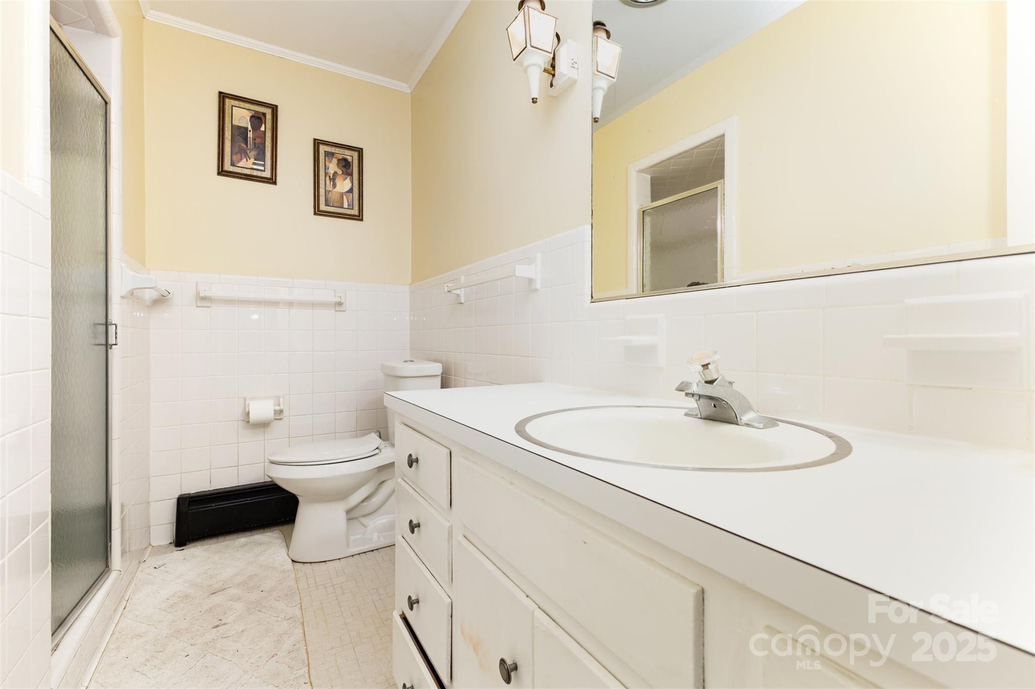 526 Rock Springs Road Lancaster, SC 29720 - Photo 18 of 22 a bathroom with a toilet sink a mirror and vanity