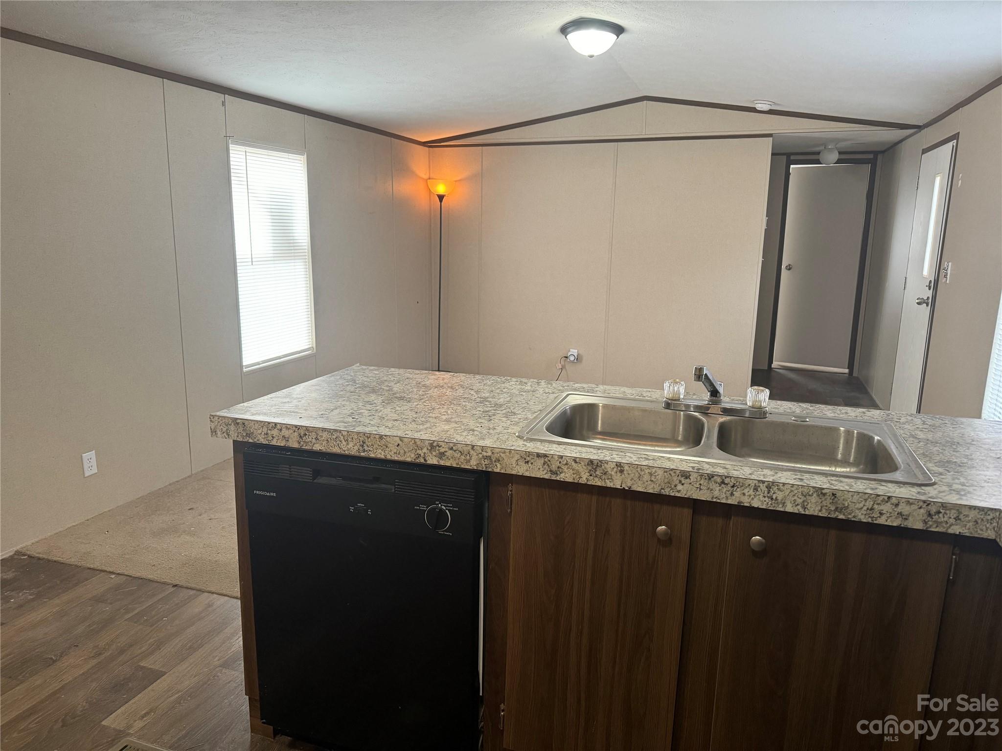 117 Railroad Street Rockingham, NC 28379 - Photo 7 of 14 a bathroom with a granite countertop sink a mirror and a bathtub