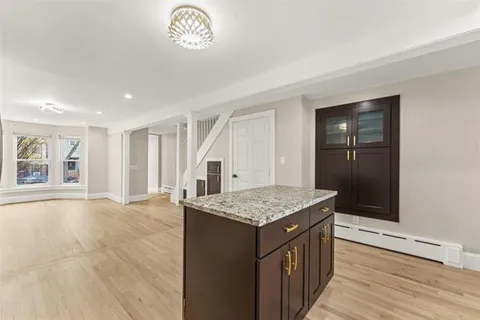 a kitchen with stainless steel appliances granite countertop a stove and a sink