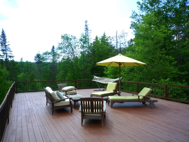 433 Main Road Savoy, MA 01256 - Photo 19 of 19 a view of a patio with a table chairs and a barbeque