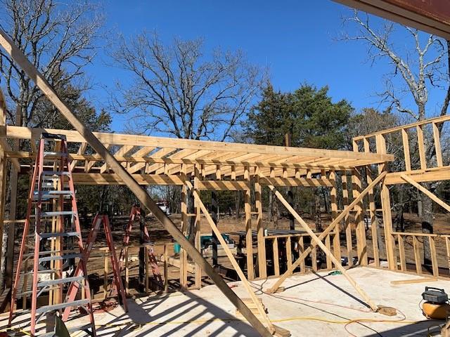 924 The Oil Road Gainesville, TX 76240 - Photo 27 of 39 Erecting Walls and Roof