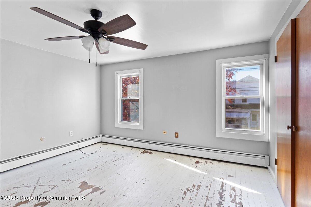 76 Mary Street Ashley, PA 18706 - Photo 16 of 30 a view of a livingroom with a ceiling fan and window