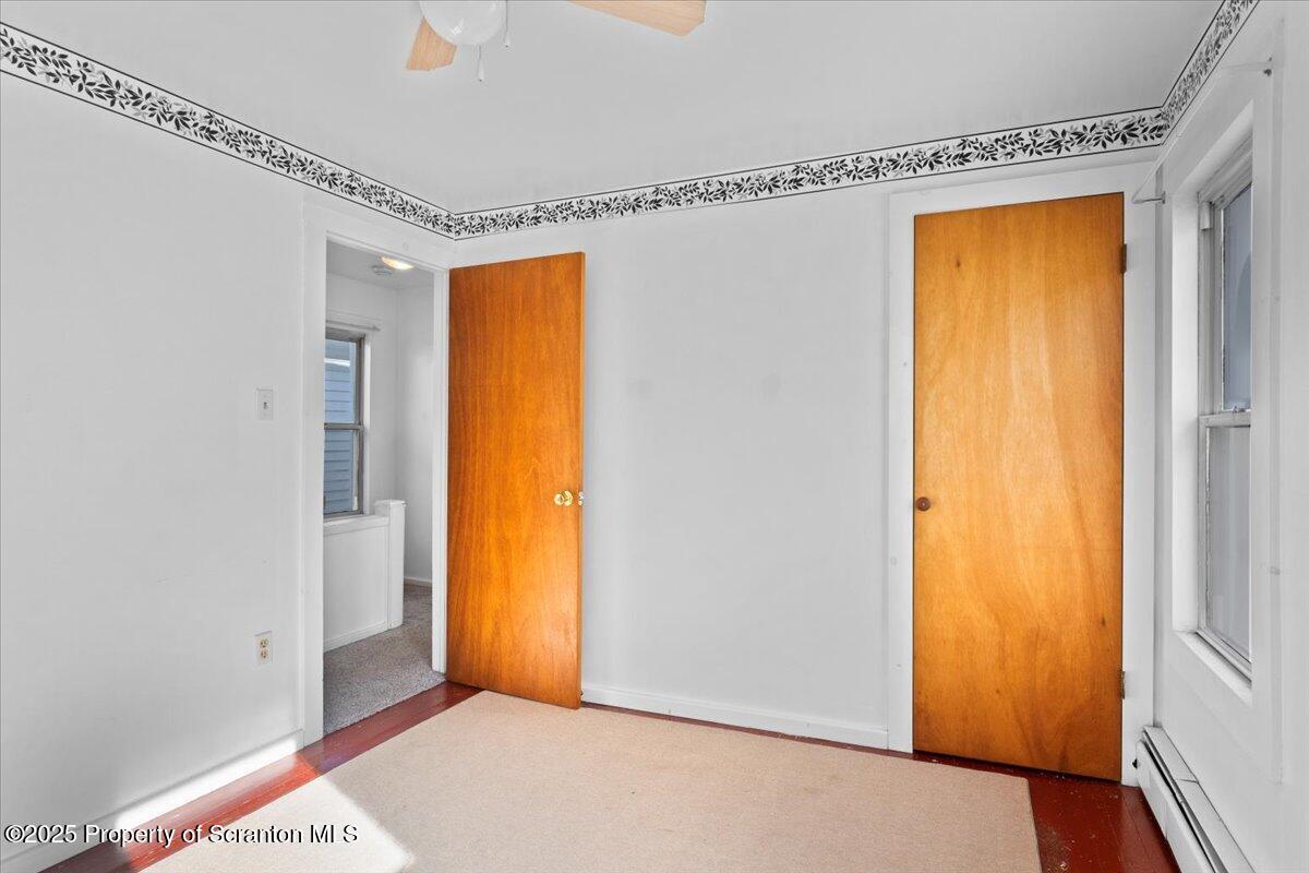 76 Mary Street Ashley, PA 18706 - Photo 20 of 30 a view of room with window and a ceiling fan
