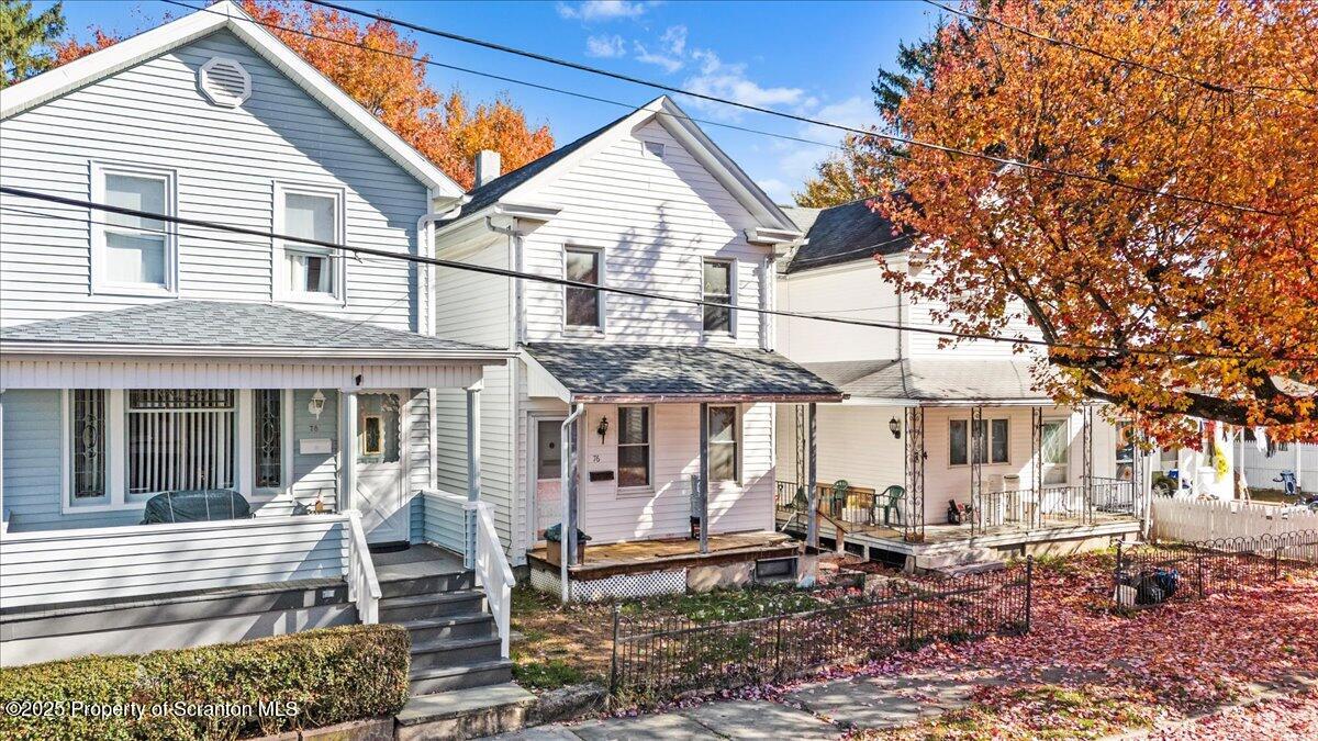 76 Mary Street Ashley, PA 18706 - Photo 2 of 30 a view of a patio with a table and chairs under an umbrella