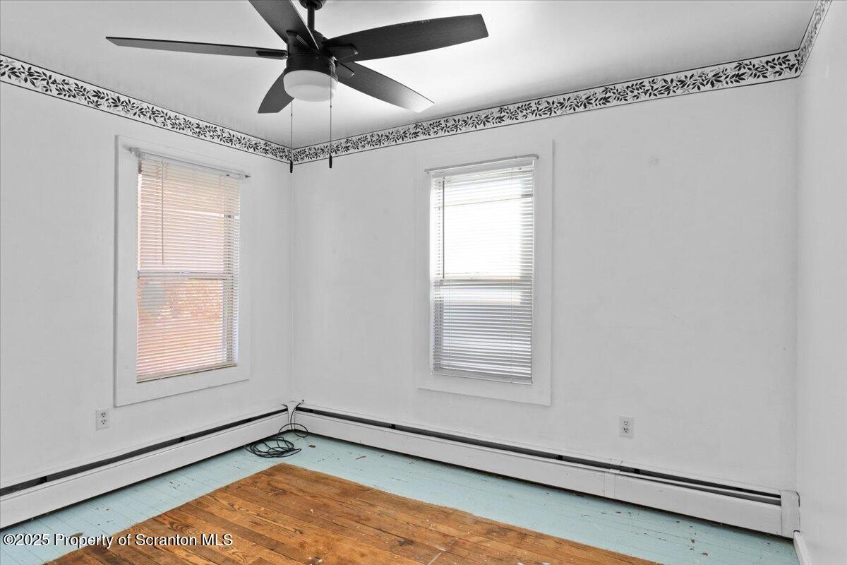 76 Mary Street Ashley, PA 18706 - Photo 21 of 30 a view of a room with window and wooden floor